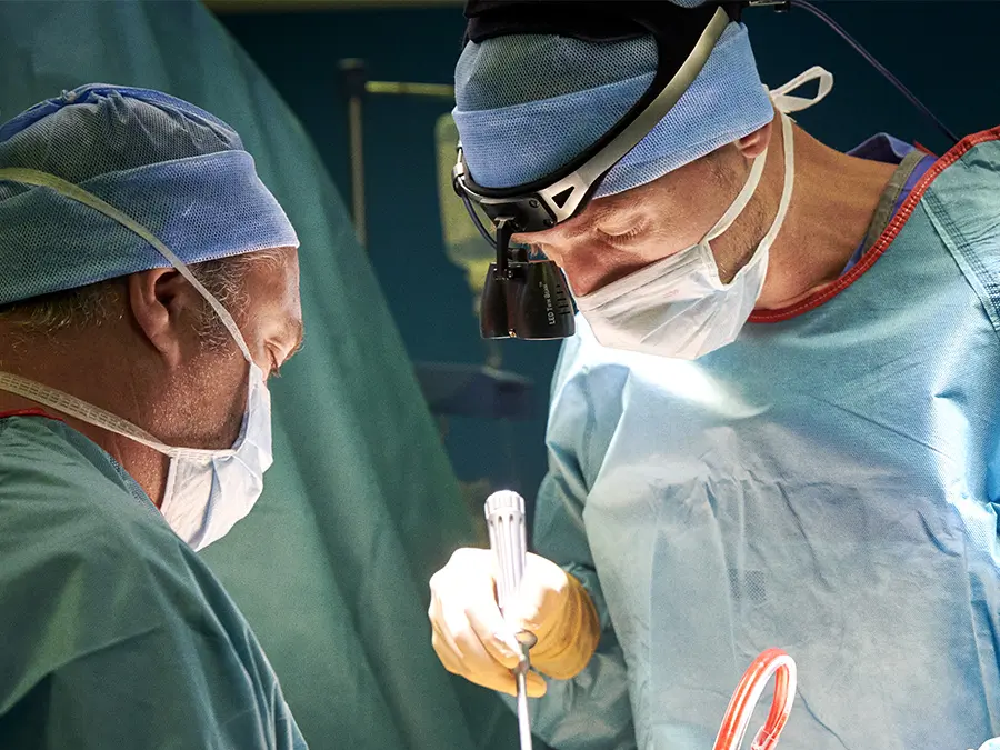 Surgeons operating on a slipped disc