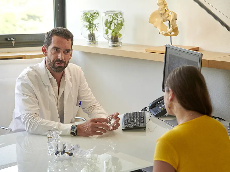 Photo of a surgeon consulting with a patient