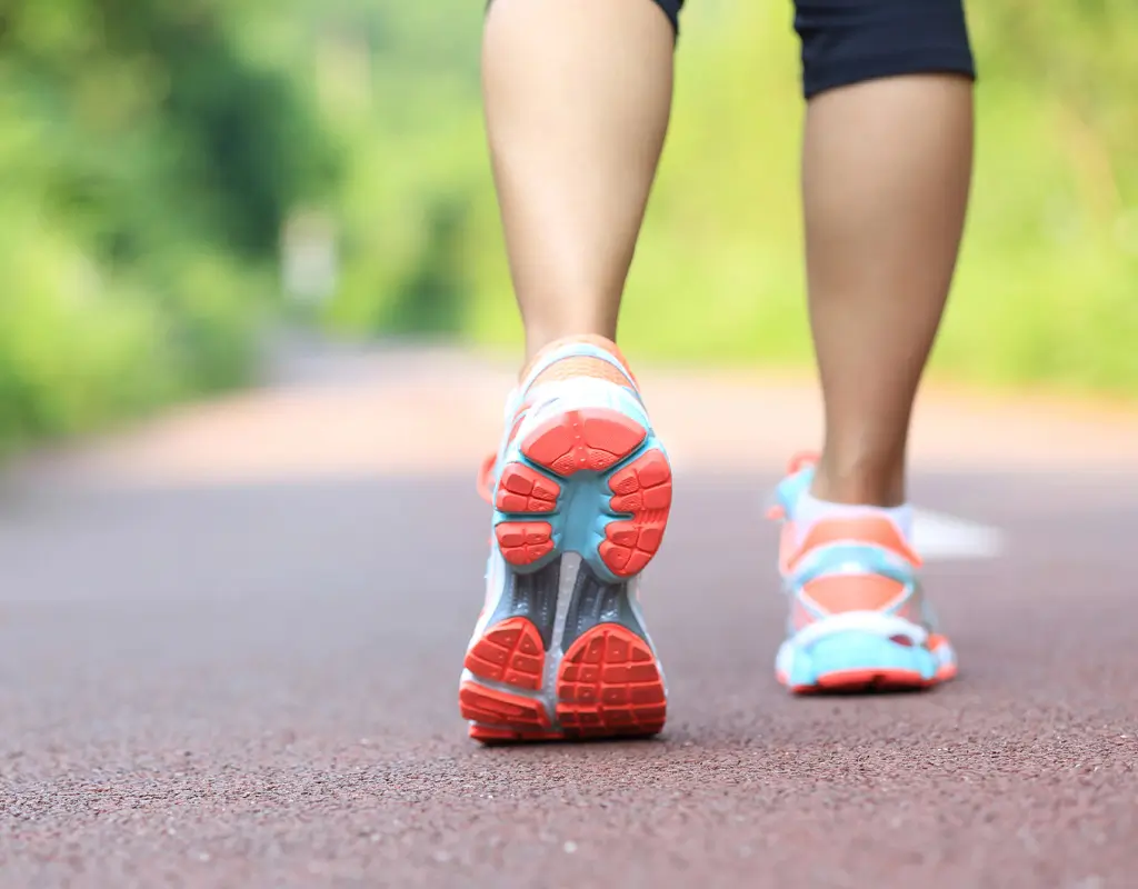 Close up of someone running showing their legs and feet